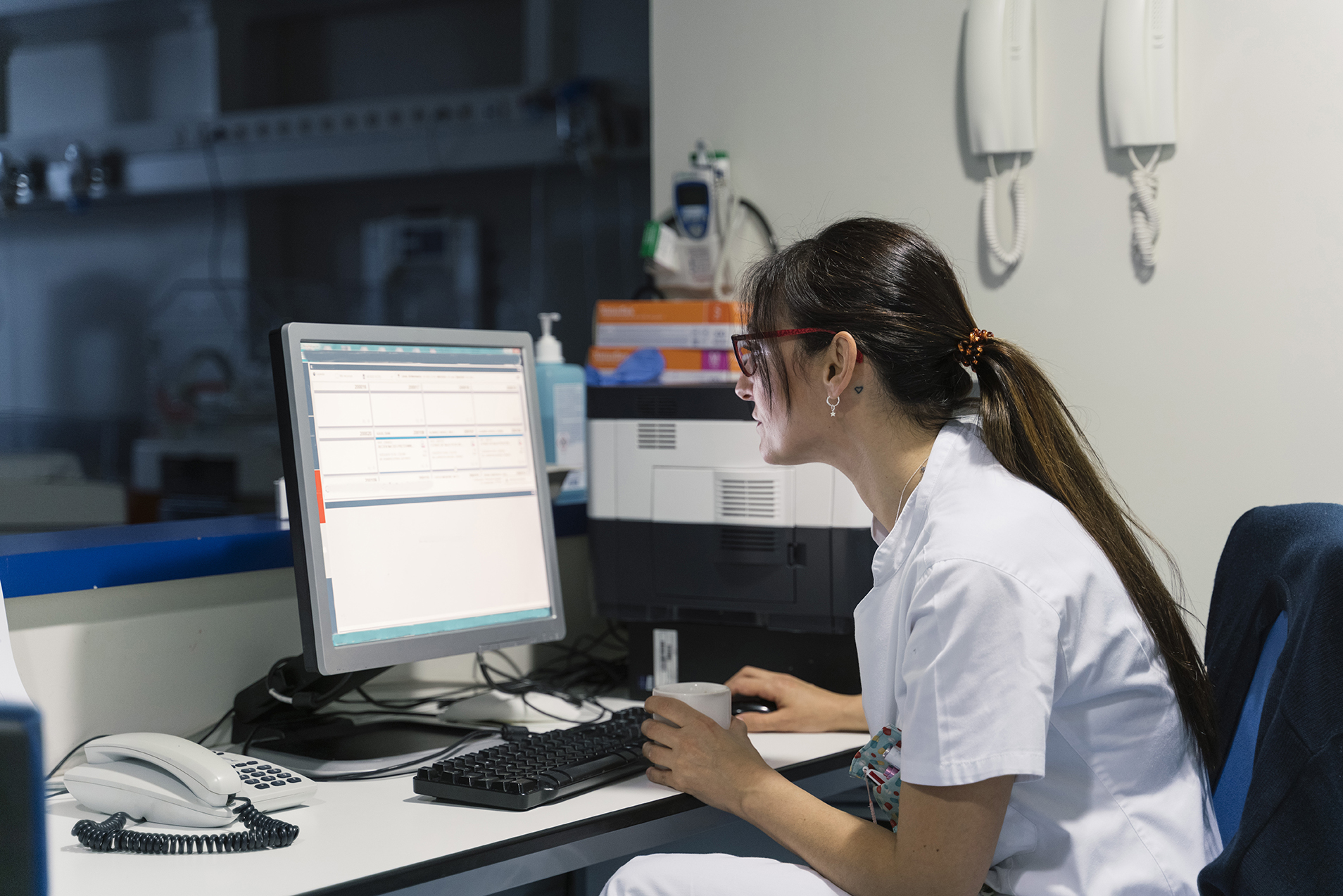 Doctor having break in hospital and drinking coffee