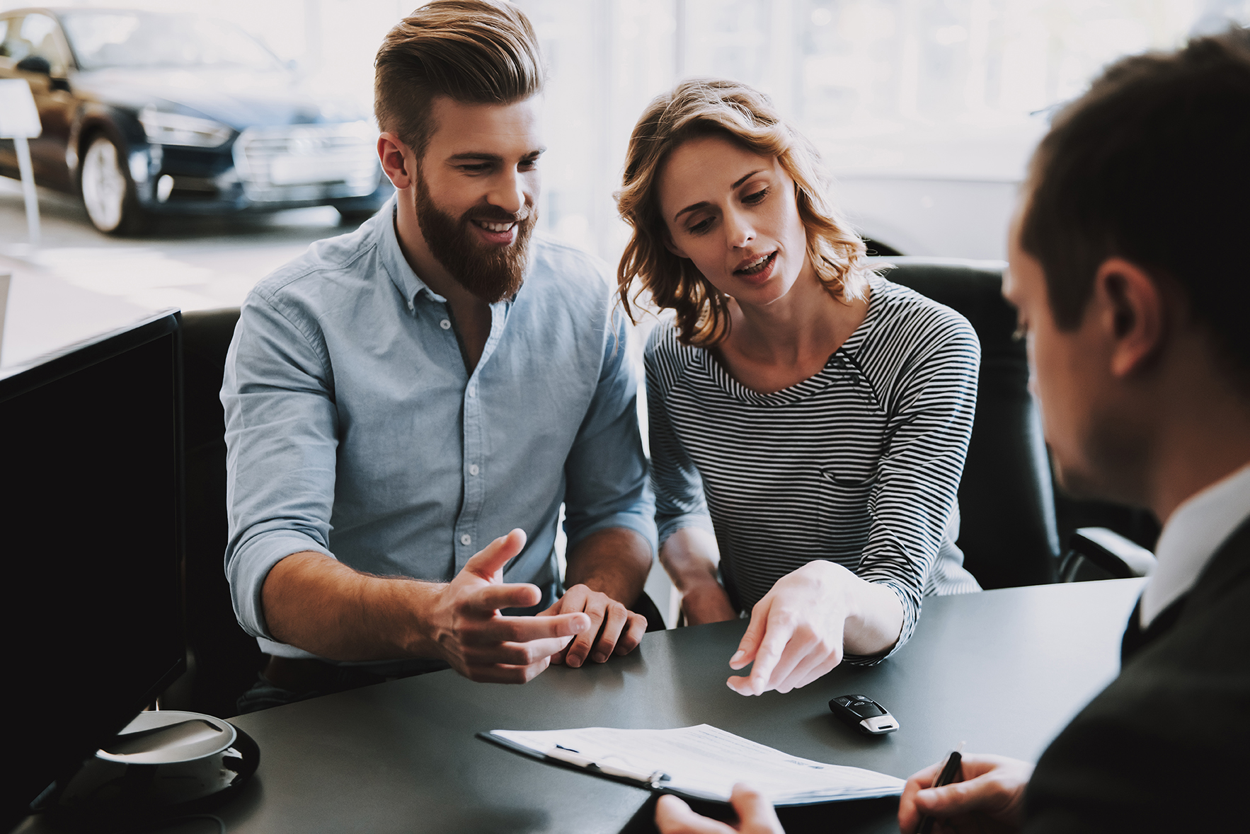 6193426 Successful Couple Talk to Car Seller in Office